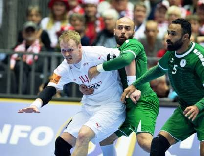 Anders Zachariassen of Denmark is held by Mahdi Alsalem of Saudi Arabia during the men s IHF Handball World Championship Group C match between Denmark and Saudi Arabia in Herning Denmark on Monday Jan 14 2019 Herning Jylland Denmark, detectedSourceLanguage  Copyright: HenningxBagger HenningxBaggerx COP101 spdk20190114-205834-L