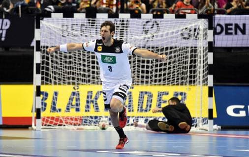 Uwe Gensheimer Germany cheers after a goal behind the defeated Victor Kireev goalkeeper Russia Russia Germany Russia Germany IHF Handball World Championship 2019 Hanball World Championship 2019 men men men Handball men Germany Germany preliminary round group A group A Berlin 14 1 2019
