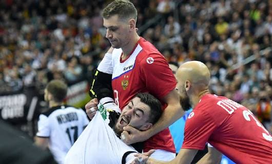 Egor Evdokimov Russia and Timur Dibirov Russia take care of Jannik Kohlbacher Germany Russia Germany Russia Germany IHF Handball World Championship 2019 Hanball World Championship 2019 Men Men Men Handball men Handball Germany Germany Preliminary Round Group A group A Berlin 14 1 2019