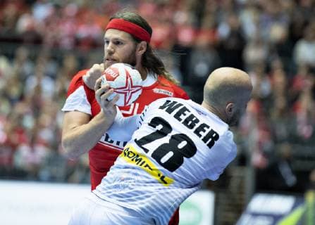 Mikkel Hansen of Denmark against Robert Weber of Austria during the IHF Handball World Championship Group C match between Austria and Denmark in Herning Denmark on Tuesday Jan 15 2019 Herning Jutland Denmark, detectedSourceLanguage  Copyright: HenningxBagger HenningxBaggerx COP101 spdk20190115-205142-L