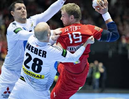 Rene Toft Hansen of Denmark against Robert Weber of Austria during the mens IHF Handball World Championship Group C match between Austria and Denmark in Herning Denmark on Tuesday Jan 15 2019 Herning Jutland Denmark, detectedSourceLanguage  Copyright: HenningxBagger HenningxBaggerx COP101 spdk20190115-205401-L