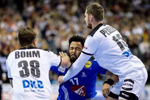 Germany vs France Handball World Championship 2019 15 01 2019 Timothey n Guessan FRA 17 against Fabian Boehm GER 38 and Hendrik Pekeler GER 13 at the match between Germany and France at the Handball World Championship in Berlin on 15 01 2019 Berlin BER Germany Mercedes Benz Arena