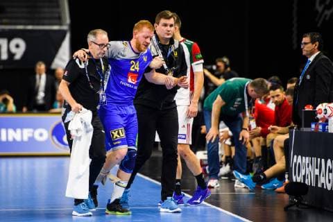 190117 Jim Gottfridsson of Sweden receives help of the pitch after injury during the IHF World Handball Championship match between Sweden and Hungary on January 17 2019 in Copenhagen Photo Ludvig Thunman BILDBYR u0081N kod LT 35581,  Copyright: LUDVIGxTHUNMAN BB190117LT036