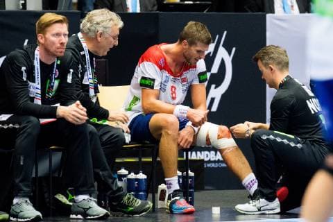 190117 Bjarte Myrhol of Norway gets medical treatment during the IHF World Handball Championship match between Denmark and Norway on January 17 2019 in Herning Photo Jon Olav Nesvold BILDBYR u0081N kod JE 160406,  Copyright: JONxOLAVxNESVOLD BB190117JE213