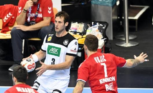 Uwe Gensheimer Germany with ball front Drasko Nenadic Serbia Stefan Vujic Serbia Germany Serbia Germany Serbia IHF Handball World Championship 2019 Hanball World Championship 2019 Men Men Men Handball Germany Germany Germany Preliminary Round Group A group A Berlin 17 1 2019
