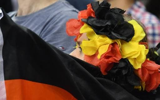A young girl with headdress and flag in German colors Agreement of the companion was given Germany Serbia Germany Serbia IHF Handball World Championship 2019 Hanball World Championship 2019 Men Men Men Handball men Germany Germany Preliminary Round Group A group A Berlin 17 1 2019