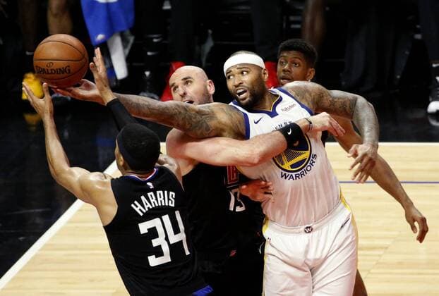 January 17, 2019 - Los Angeles, California, U.S - Golden State Warriors DeMarcus Cousins (0) goes to basket while defended by Los Angeles Clippers Tobias Harris (34) and Los Angeles Clippers Marcin Gortat (13) during an NBA Basketball Herren USA basketball game between Los Angeles Clippers and Golden State Warriors Friday, Jan. 18, 2019, in Los Angeles. NBA 2019: Clippers 94:112 Warriors - ZUMAc68_ 20190117_zaf_c68_030 Copyright: xRingoxChiux