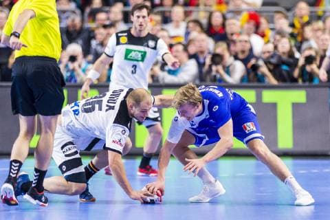 Cologne Germany 19 January 2019 World Cup 2019 Men Main Round Germany vs Iceland Paul Drux Germany Foxes Berlin and Gisli Thorgeir Kristjansson Iceland in the fight for the ball Cologne Lanxess Arena North Rhine-Westphalia Germany
