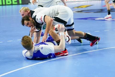 GER IHF WM 2019 Germany GER vs Iceland ISL 19 01 2019 Lanxess Arena Cologne GER IHF WM 2019 Germany GER vs Iceland ISL picture shows Ãmir Örn Oern Gislason ISL 11 Paul Drux GER 95 Patrick Wiencek GER 7 nordphotox xMeuter nph00351