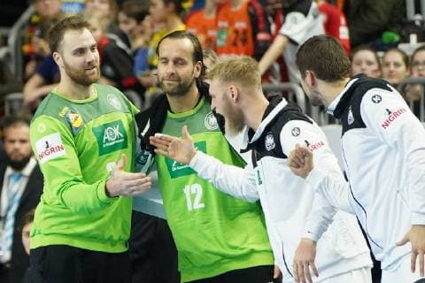 GER IHF WM 2019 Germany GER vs Iceland ISL 19 01 2019 Lanxess Arena Cologne GER IHF WM 2019 Germany GER vs Iceland ISL picture shows Silvio Heinevetter Goalkeeper GER 12 and Andreas Wolff Goalkeeper GER 33 are happy with Matthias Musche GER 37 nordphotox xMeuter nph00351