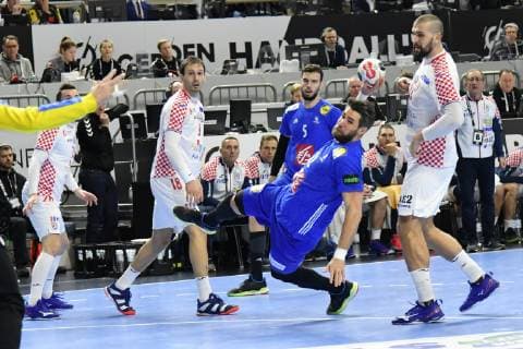 GER IHF WM 2019 France FRA vs Croatia CRO 23 01 2019 Lanxess Arena Cologne GER IHF WM 2019 France FRA vs Croatia CRO in picture picture shows Luka KarabatiÄ‡ FRA 22 with a goal Zeljko Musa CRO 28 can do nothing nordphotox xMeuter nph00351