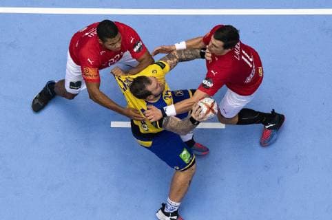 January 23, 2019 - Herning, Denmark - Mads Mensah (22), Denmark and Rasmus Lauge (11), Denmark block Linus Arnesson, Sweden in attacking during the group C handball match between Denmark and Sweden in Jyske Bank Boxen in Herning during the 2019 IHF Handball World Championship WM Weltmeisterschaft in Germany Denmark. Handball 2019: Denmark-Sweden - ZUMAm173 20190123_zsp_m173_009 Copyright: xLarsxMoellerx