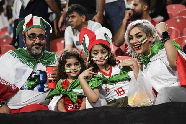 Iran fans wave slogans and national flags to show support to Iran national men s football team in their quarter-final match against China during the 2019 AFC Asian Cup in Abu Dhabi, United Arab Emirates, 24 January 2019. Iran fans cheer for quarter-final match against China  scr161748