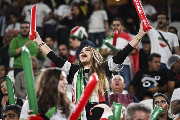 Iran fans wave slogans and national flags to show support to Iran national men s football team in their quarter-final match against China during the 2019 AFC Asian Cup in Abu Dhabi, United Arab Emirates, 24 January 2019. Iran fans cheer for quarter-final match against China  scr161694