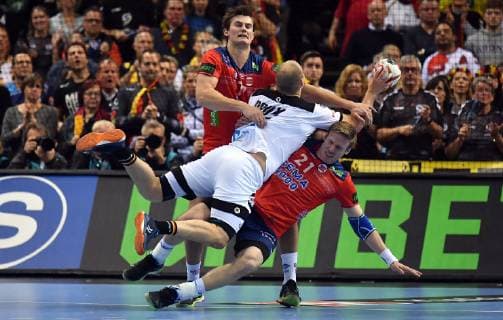 Paul Drux Germany in throw against Magnus Rod Magnus Roed Norway and Magnus Gullerud Norway Germany Norway Germany Norway IHF Handball World Championship 2019 Handball World Championship 2019 Men Men Men Handball men Handball Germany Germany Semifinal Game 2 half final Hamburg 25 1 2019