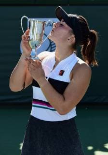NEWPORT BEACH, CA - JANUARY 27: Bianca Andreescu (CAN) kisses the winners trophy after defeating Jessica Pegula (USA) in three sets to become champion of the 2019 Oracle Challenger Series played on January 27, 2019 at the Newport Beach Tennis Club in Newport Beach, CA. (Photo by John Cordes Icon Sportswire) TENNIS: JAN 27 Oracle Challenger Series Icon506190127015 EDITORIAL USE ONLY