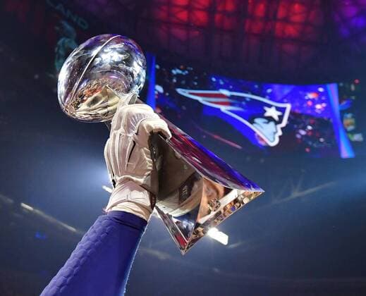New England Patriots hold up the Vince Lombardi Trophy after the Patriots won Super Bowl LIII 13-3 over the Los Angeles Rams at Mercedes-Benz Stadium on February 3, 2019 in Atlanta.  SBP201902032017 KEVINxDIETSCH