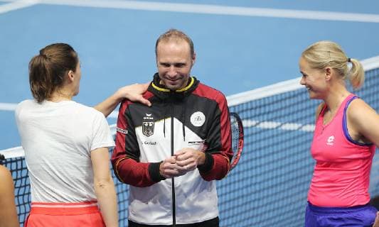 Team captain Jens Gerlach GER in the midst of his players during afternoon training