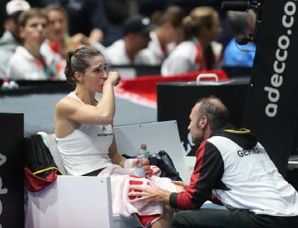 Andrea Petkovic GER cries on the right Team captain Jens Gerlach GER