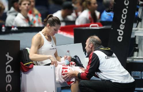 Andrea Petkovic GER cries on the right Team captain Jens Gerlach GER