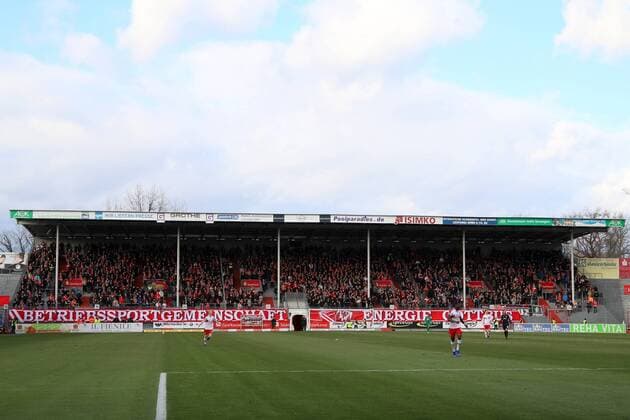The north wall in the stadium of friendship with the big fan banner football 3 League FC Energie Cottbus Würzburger kickers