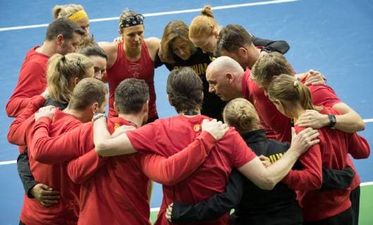 Belgian captain Johan Van Herck talks to his team after a doubles tennis match of Belgians Ysaline Bonaventure and Kirsten Flipkens versus French Fiona Ferro and Pauline Parmentier, the fifth and final rubber of the Fed Cup tennis meeting between Belgium and France, the quarter-finals of the World Group, Sunday 10 February 2019 in Liege. BENOITxDOPPAGNE  x05528211x