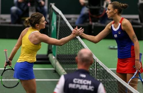 Romanian tennis player Simona Halep (left) shakes hands with Karolina Pliskova of the Czech Republic after the Fed Cup World Group, 1st Round, between Czech Republic and Romania, in Ostrava, Czech Republic, on February 10, 2019. (CTKxPhoto PetrxSznapka) CTKPhotoP201902100436701  PRY 19