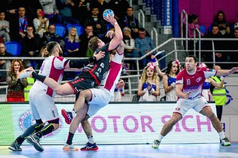 Centre back Barys Pukhouski (R) of HC Motor Zaporizhzhia focuses on the ball served by a player of SG Flensburg-Handewitt during the 2018 2019 VELUX EHF Champions League Group B match at the Yunist Palace of Sports, Zaporizhzhia, southeastern Ukraine, February 10, 2019. Ukrinform. EHF Champions League: Motor snatches 28-26 win over Flensburg at home  Copyright: xDmytroxSmolyenkox