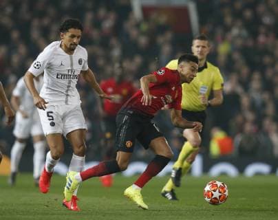 Marcos Marquinhos of PSG tackles Jesse Lingard of Manchester United ManU during the UEFA Champions League Round of 16 First Leg match at the Old Trafford Stadium, Manchester. Picture date: 12th February 2019. Picture credit should read: Andrew Yates Sportimage EDITORIAL USE ONLY. No use with unauthorised audio, video, data, fixture lists, club league logos or live services. Online in-match use limited to 120 images, no video emulation. No use in betting, games or single club league player publications. _AY20098.JPG
