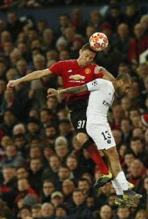 Nemanja Matic of Manchester United ManU challenges Dani Alves of PSG during the UEFA Champions League Round of 16 First Leg match at the Old Trafford Stadium, Manchester. Picture date: 12th February 2019. Picture credit should read: Andrew Yates Sportimage EDITORIAL USE ONLY. No use with unauthorised audio, video, data, fixture lists, club league logos or live services. Online in-match use limited to 120 images, no video emulation. No use in betting, games or single club league player publications. _AY20238.JPG