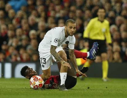 Dani Alves of PSG tackles Paul Pogba of Manchester United ManU during the UEFA Champions League Round of 16 First Leg match at the Old Trafford Stadium, Manchester. Picture date: 12th February 2019. Picture credit should read: Andrew Yates Sportimage EDITORIAL USE ONLY. No use with unauthorised audio, video, data, fixture lists, club league logos or live services. Online in-match use limited to 120 images, no video emulation. No use in betting, games or single club league player publications. SPI_040_AY_MANU_PSG.jpg