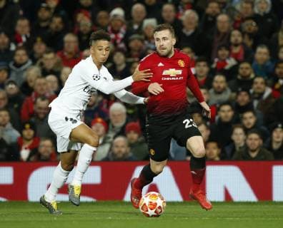 Luke Shaw of Manchester United ManU breaks past Thilo Kehrer of PSG during the UEFA Champions League Round of 16 First Leg match at the Old Trafford Stadium, Manchester. Picture date: 12th February 2019. Picture credit should read: Andrew Yates Sportimage EDITORIAL USE ONLY. No use with unauthorised audio, video, data, fixture lists, club league logos or live services. Online in-match use limited to 120 images, no video emulation. No use in betting, games or single club league player publications. SPI_041_AY_MANU_PSG.jpg