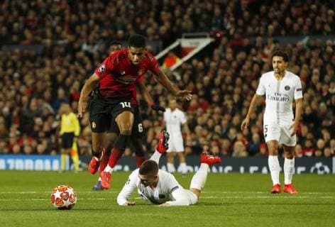 Marcus Rashford of Manchester United ManU goes over Marco Verratti of PSG during the UEFA Champions League Round of 16 First Leg match at the Old Trafford Stadium, Manchester. Picture date: 12th February 2019. Picture credit should read: Andrew Yates Sportimage EDITORIAL USE ONLY. No use with unauthorised audio, video, data, fixture lists, club league logos or live services. Online in-match use limited to 120 images, no video emulation. No use in betting, games or single club league player publications. _AY13750.JPG
