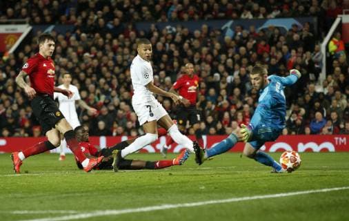 Kylian Mbappe of PS scores the second goal during the UEFA Champions League Round of 16 First Leg match at the Old Trafford Stadium, Manchester. Picture date: 12th February 2019. Picture credit should read: Andrew Yates Sportimage EDITORIAL USE ONLY. No use with unauthorised audio, video, data, fixture lists, club league logos or live services. Online in-match use limited to 120 images, no video emulation. No use in betting, games or single club league player publications. _AY13964.JPG