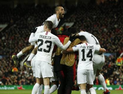 Dani Alves of PSG jumps up as Kylian Mbappe of PS celebrates scoring the second goal during the UEFA Champions League Round of 16 First Leg match at the Old Trafford Stadium, Manchester. Picture date: 12th February 2019. Picture credit should read: Andrew Yates Sportimage EDITORIAL USE ONLY. No use with unauthorised audio, video, data, fixture lists, club league logos or live services. Online in-match use limited to 120 images, no video emulation. No use in betting, games or single club league player publications. _AY14035.JPG