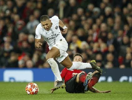 Kylian Mbappe of PSG tackled by Ander Herrera of Manchester United ManU during the UEFA Champions League Round of 16 First Leg match at the Old Trafford Stadium, Manchester. Picture date: 12th February 2019. Picture credit should read: Andrew Yates Sportimage EDITORIAL USE ONLY. No use with unauthorised audio, video, data, fixture lists, club league logos or live services. Online in-match use limited to 120 images, no video emulation. No use in betting, games or single club league player publications. _AY20880.JPG