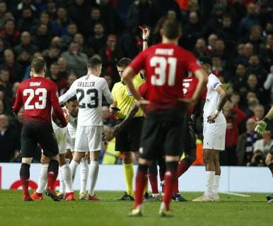 Referee Daniele Orsato shows the red card for Paul Pogba of Manchester United ManU during the UEFA Champions League Round of 16 First Leg match at the Old Trafford Stadium, Manchester. Picture date: 12th February 2019. Picture credit should read: Andrew Yates Sportimage EDITORIAL USE ONLY. No use with unauthorised audio, video, data, fixture lists, club league logos or live services. Online in-match use limited to 120 images, no video emulation. No use in betting, games or single club league player publications. _AY20915.JPG