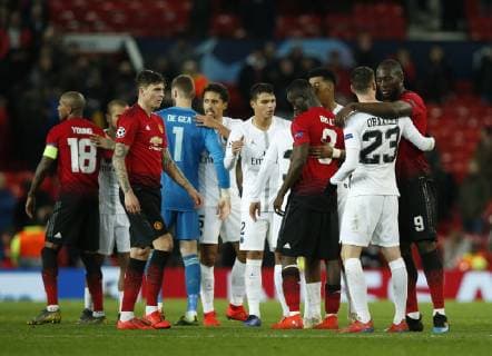 PSG and Manchester Utd players at the end of the match during the UEFA Champions League Round of 16 First Leg match at the Old Trafford Stadium, Manchester. Picture date: 12th February 2019. Picture credit should read: Andrew Yates Sportimage EDITORIAL USE ONLY. No use with unauthorised audio, video, data, fixture lists, club league logos or live services. Online in-match use limited to 120 images, no video emulation. No use in betting, games or single club league player publications. _AY21050.JPG