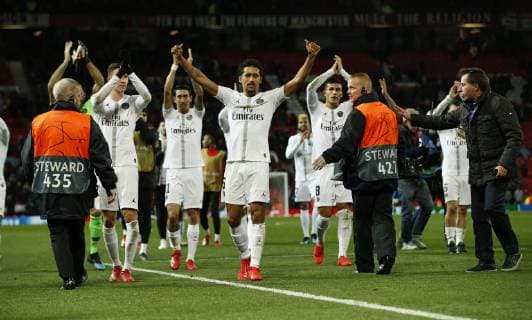 PSG players attempt to celebrate with their fans during the UEFA Champions League Round of 16 First Leg match at the Old Trafford Stadium, Manchester. Picture date: 12th February 2019. Picture credit should read: Andrew Yates Sportimage EDITORIAL USE ONLY. No use with unauthorised audio, video, data, fixture lists, club league logos or live services. Online in-match use limited to 120 images, no video emulation. No use in betting, games or single club league player publications. _AY14208.JPG