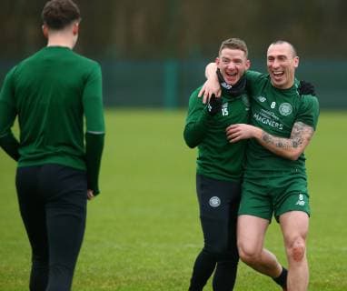 13th February 2019, Lennoxtown Training Centre, Glasgow, Scotland; Celtic Training session ahead of their Europa League tie against Valencia on 14th February; Jonny Hayes and Scott Brown of Celtic joke with Jack Hendry of Celtic  ActionPlus12105056 VagelisxGeorgariou