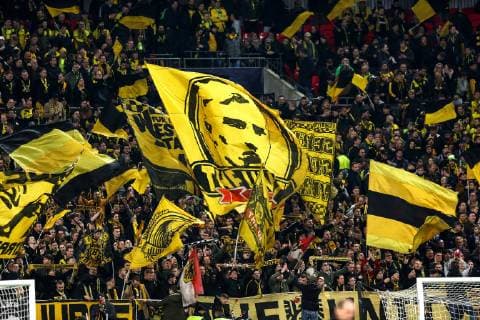 Sport Bilder des Tages 13th February 2019, Wembley Stadium, London England; UEFA Champions League football, Tottenham Hotspur versus Borussia Dortmund; A giant Borussia Dortmund flag is waved by fans  ActionPlus12105151 JohnxPatrickxFletcher
