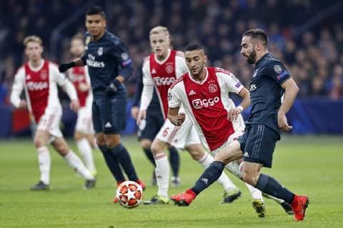AMSTERDAM, Ajax - Real Madrid, football, Champions League Season 2018 2019, 13-02-2019, Johan Cruijff Arena. Ajax player Hakim Ziyech (C) and Real Madrid player Dani Carvajal (R) during the game Ajax - Real Madrid. Ajax - Real Madrid  x2820738x
