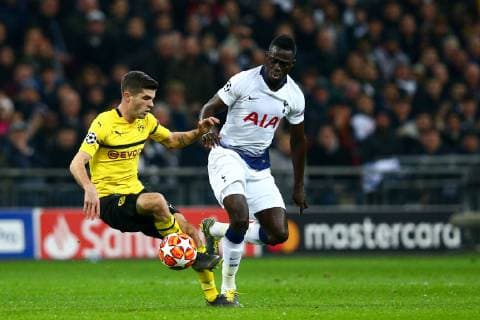 Christian Pulisic of Borussia Dortmund holds off the challenge from Davinson Sanchez of Tottenham Hotspur during the UEFA Champions League Round of 16 First Leg match at Wembley Stadium, London. Picture date: 13th February 2019. Picture credit should read: Craig Mercer Sportimage EDITORIAL USE ONLY. No use with unauthorised audio, video, data, fixture lists, club league logos or live services. Online in-match use limited to 120 images, no video emulation. No use in betting, games or single club league player publications. C77R1622.JPG