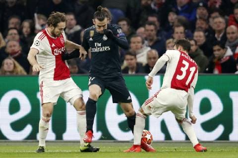 (l-r) Daley Blind of Ajax, Gareth Bale of Real Madrid, Nico Tagliafico of Ajax during the UEFA Champions League round of 16 match Ajax Amsterdam and Real Madrid at the Johan Cruijff Arena on February 13, 2019 in Amsterdam, The Netherlands UEFA Champions League 2018 2019 xVIxVIxImagesx xMauricexvanxSteenxIVx 13620306