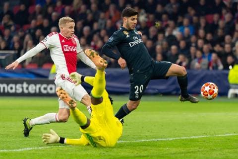 Amsterdam Netherlands 13 02 2019 UEFA Champions League 2018 19 Season Quarterfinal Ajax Amsterdam Real Madrid Goal to 1 2 by Marco Asensio Real Madrid Donny van de Beek Ajax Amsterdam Kasper Dolberg Ajax Amsterdam and Marco Asensio Real Madrid in the duel battle for the ball DeFodi001