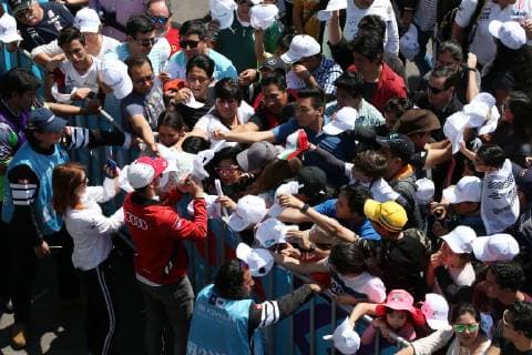 Daniel Abt GER surrounded by many visitors gives autographs in paddock E Village Formula E Grand Prix Mexico City 16 02 2019