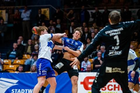 Handball 2 Bundesliga Men Season 2018 2019 Dessau Rosslauer HV 06 VfL Lübeck Schwartau Jonas Ottsen 7 VfL Lübeck Schwartau on the ball with Johannes Wasielewskie 18 Dessau Rosslauer HV 06 during the season 2018 2019 in the Handball 2 Bundesliga Men between Dessau Rosslauer HV 06 and VfL Lübeck Schwartau in the Anhalt Arena on 17 February 2019 in Bauhausstadt Dessau Sachsen Anhalt Saxony Anhalt Germany Germany