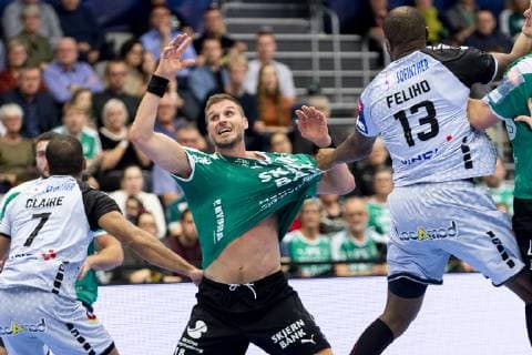 Bjarte Myrhol 18 from Skjern Handball calls on the ball while Rock Feliho 13 from HBC Nantes has caught him during the Champions League group fight in mens handball between Skjern Handball and HBC Nantes in Skjern Bank Arena in Skjern Sunday, February 17, 2019 Skjern,  Copyright: MadsxDalegaardx cop106 spdk20190217-185310-L