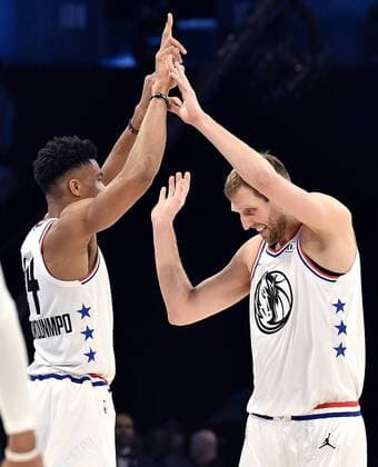 Sport Themen der Woche KW07 Sport Bilder des Tages February 17, 2019 - Charlotte, NC, USA - Dallas Mavericks Dirk Nowitzki, right, is all smiles as he is congratulated by teammate Milwaukee Bucks Giannis Antetokounmpo, left, after hitting two three-point baskets during the NBA Basketball Herren USA All-Star Game at Spectrum Center in Charlotte, N.C. on Sunday, February 17, 2019. 2019 NBA All-Star Game - ZUMAm67_ 20190217_zaf_m67_112 Copyright: xJeffxSinerx