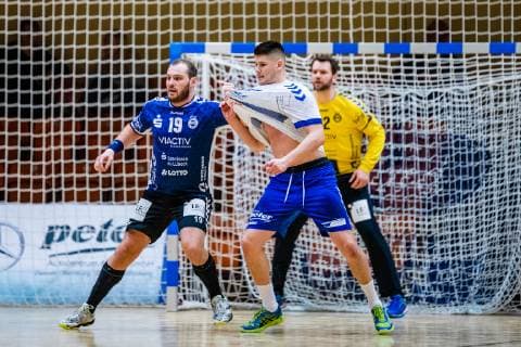 Handball 2 Bundesliga Men Season 2018 2019 Dessau Rosslauer HV 06 VfL Lübeck Schwartau Jan Schult 19 VfL Lübeck Schwartau Philip Jungemann 21 Dessau Rosslauer HV 06 during the season 2018 2019 in the Handball 2 Bundesliga Men between Dessau Rosslauer HV 06 and VfL Lübeck Schwartau in the Anhalt Arena on 17 February 2019 in Bauhausstadt Dessau Sachsen Anhalt Saxony Anhalt Germany Germany
